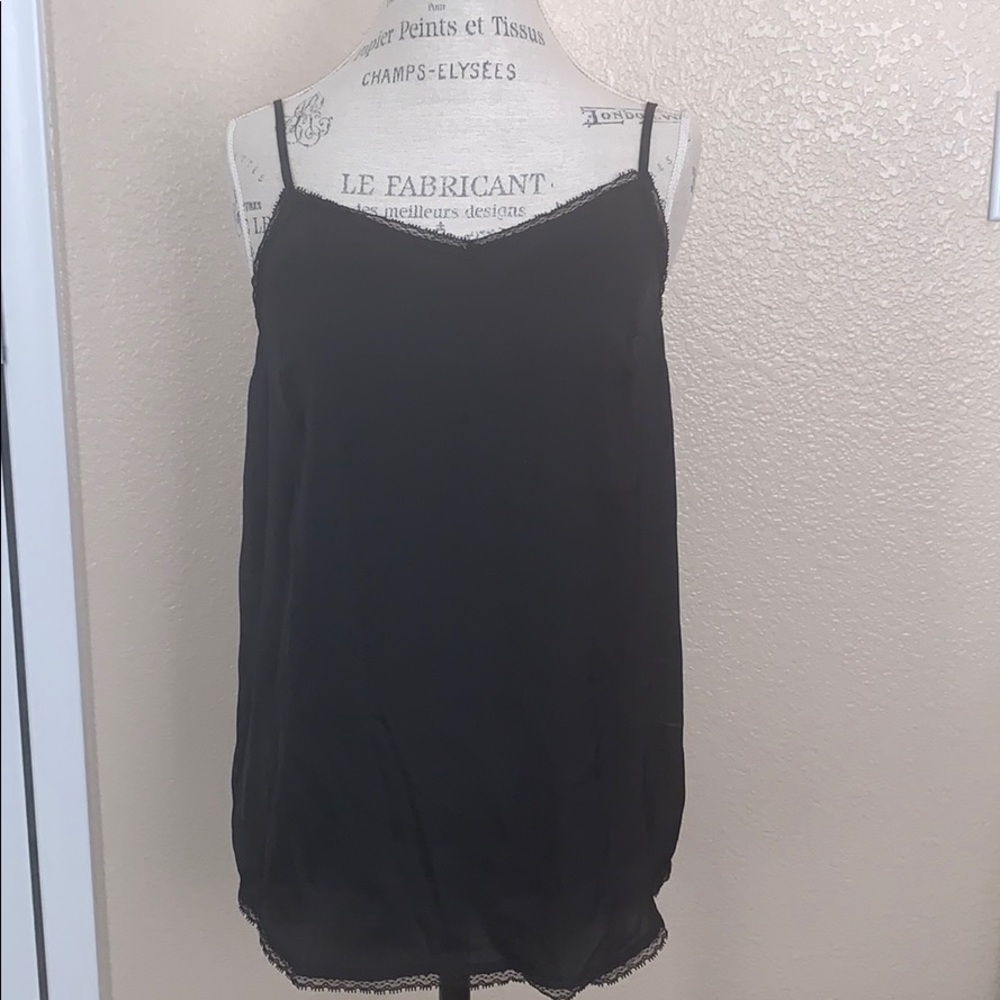Spaghetti strap blouse with lace detail.
